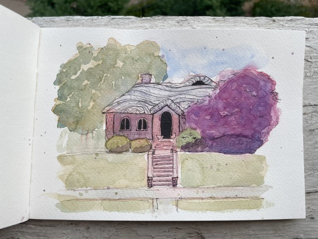 A watercolor and ink sketch of a small house.